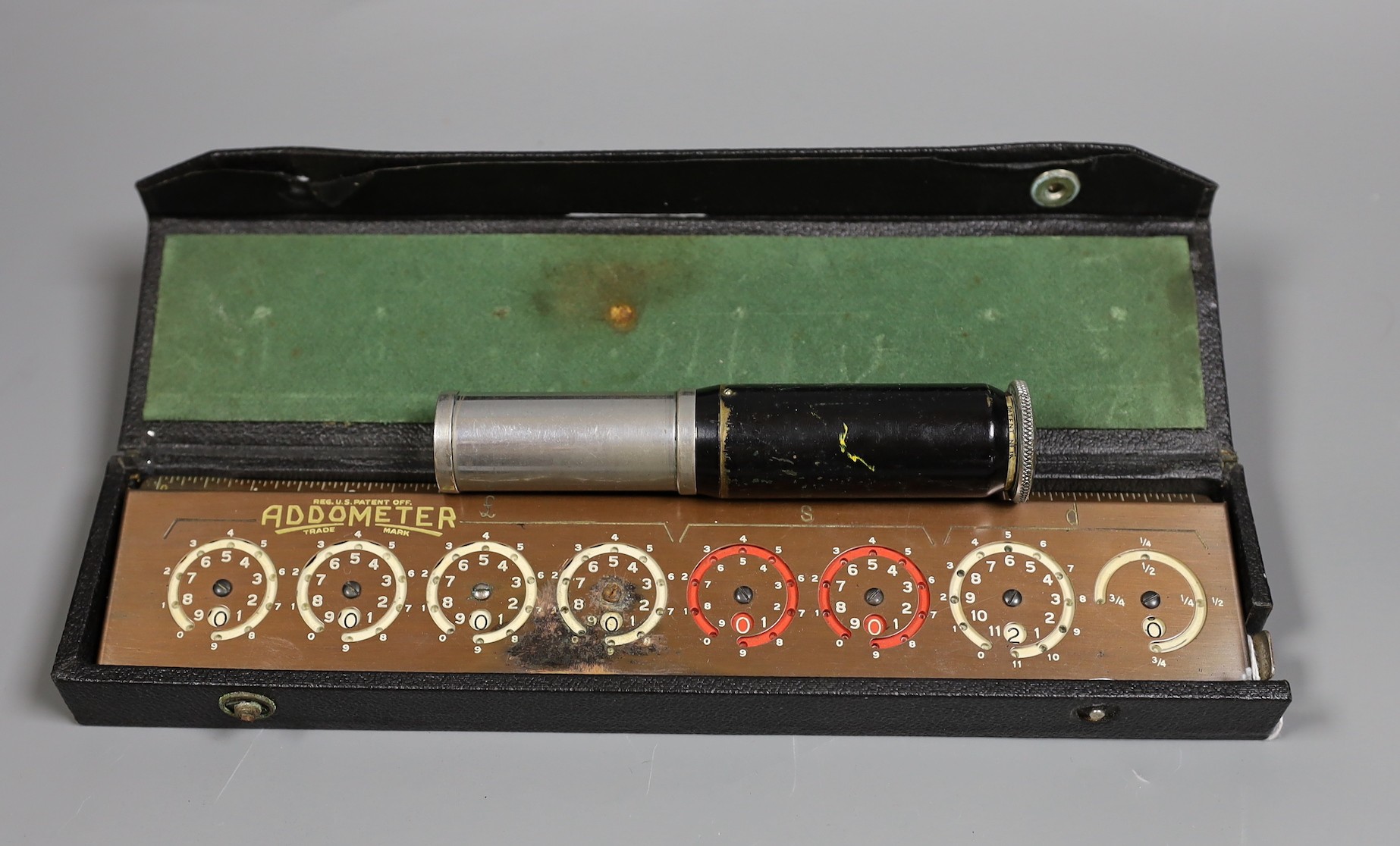 An Otis King's pocket calculator and a cased Addometer